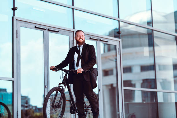 istock Modern Businessman Going Home From Work With Bicycle 1338927276