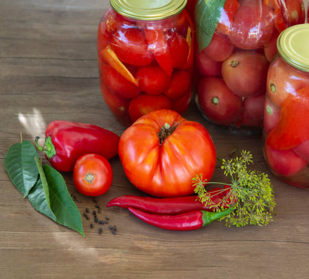 istock Preserves vegetables in glass on wood background, marinated ferm 1338927983