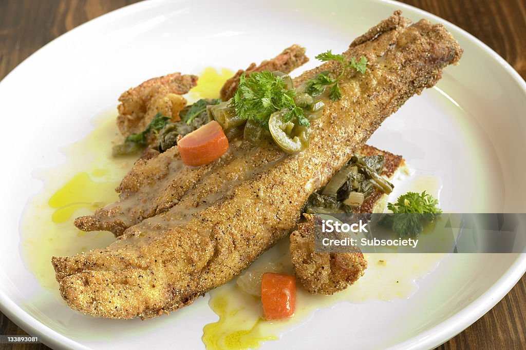 Catch of the day fried catfish plate with veggies Fried Stock Photo
