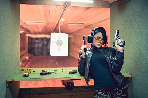 Tough Female Ready To Shoot Guns On Firing Range