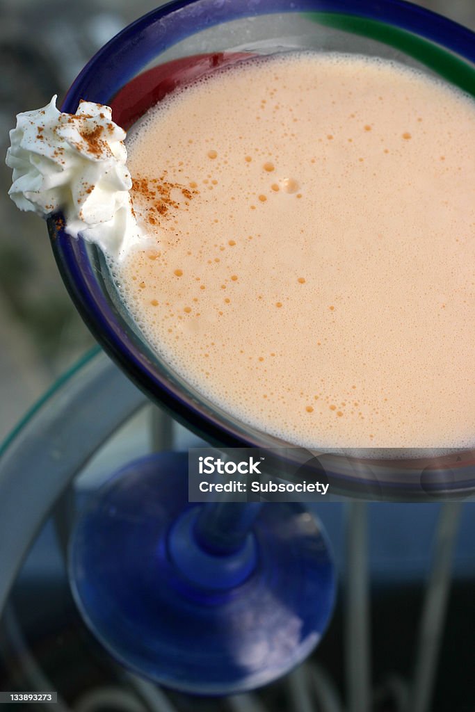 Pumpkin pie martini Pumpkin pie martini with whipped cream on glass table Alcohol - Drink Stock Photo