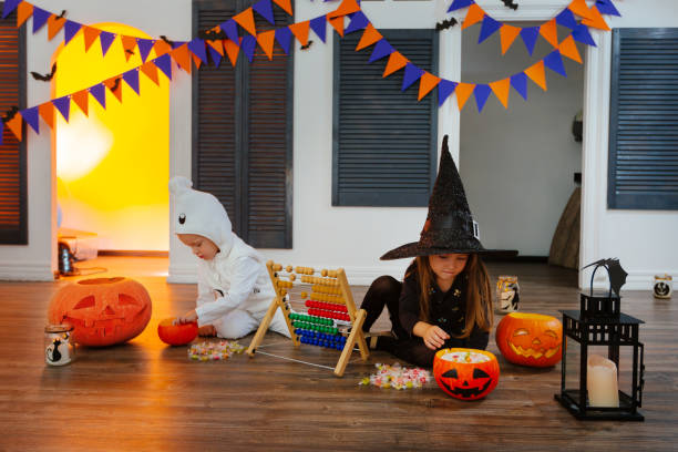 istock children have fun counting the collected candies 1338932963