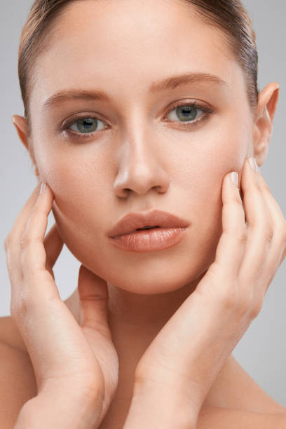 istock Pretty lady with clear skin posing with no makeup. 1338933127