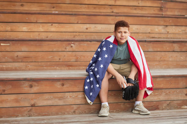 College Baseball Player With American Flag