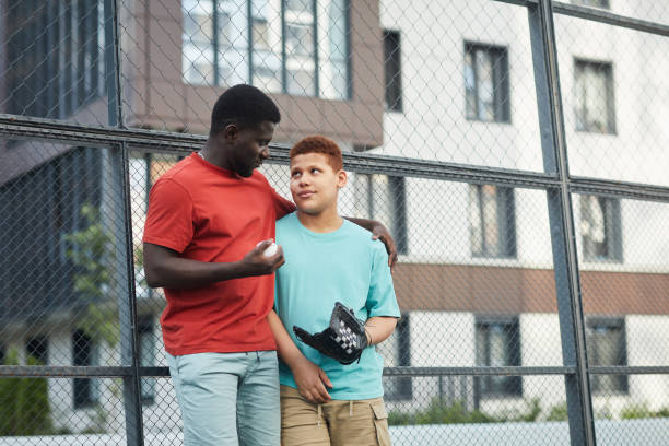istock Father Talking About Baseball To Son 1338935588