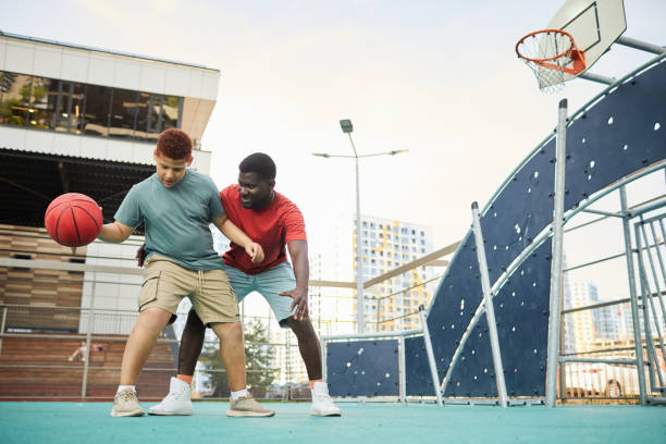 istock Enjoying Basketball With Father 1338935612