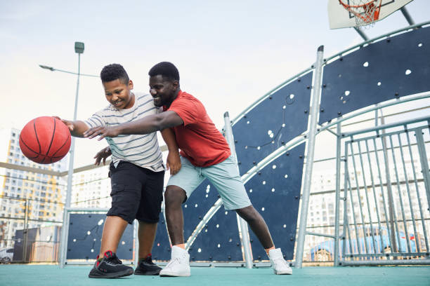 istock Trying To Tackle Basketball 1338935616