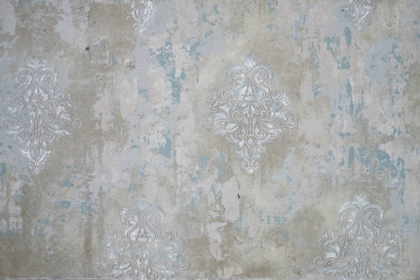 istock gray concrete shabby wall with elegant vintage volumetric swirl patterns 1338937105