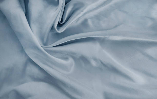 istock silk gray beautiful fabric background 1338937153