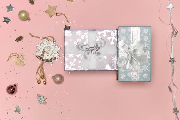 istock Gifts in silver-colored wrapping paper with a bow. 1338939676