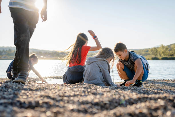 istock Children playing on the beach near Lake 1338940792