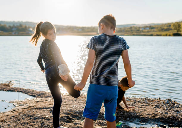 istock Children playing at the lake 1338941895