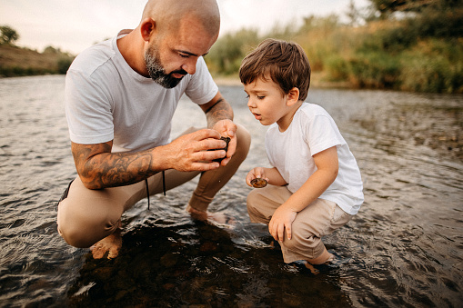Father and son, exploring the river