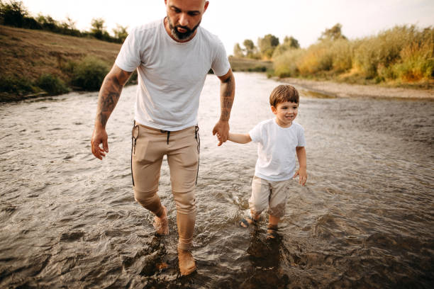 Father and son, exploring the river