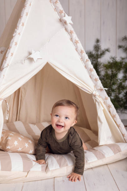 One year old boy with tent stock photo