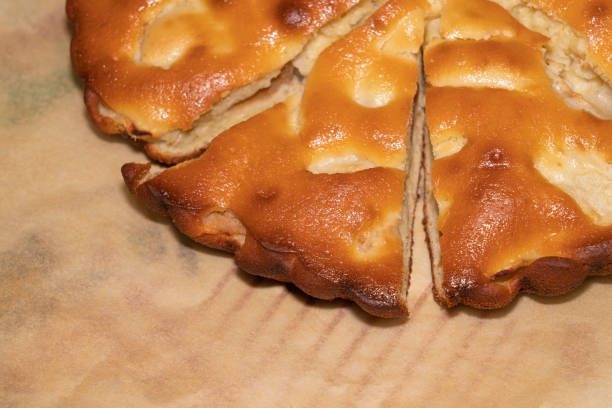 istock apple pie cut into pieces on paper close-up 1338946342