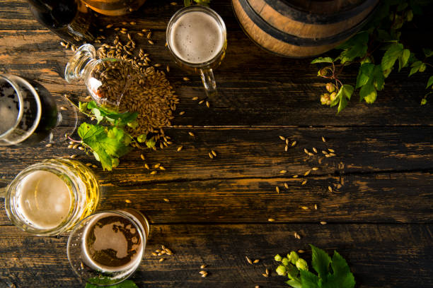 istock Cold beer with foam on a wooden table 1338946845