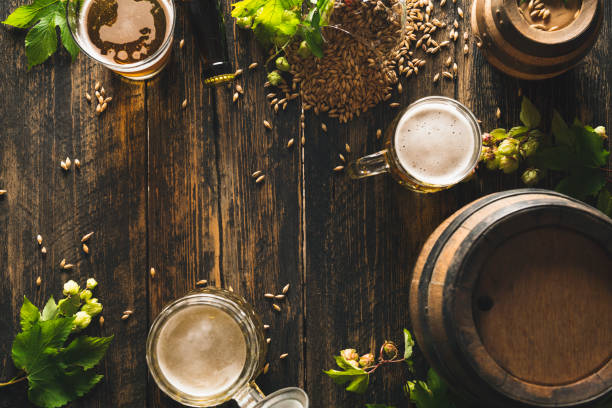 istock Cold beer with foam on a wooden table 1338947470