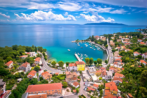 Icici village beach and waterfront in Opatija riviera aerial view, turquoise sea and blue sky, Kvarner, Croatia
