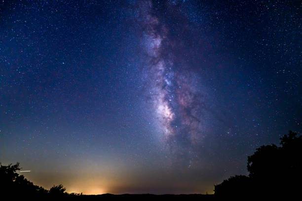 istock Milky Way Galaxy in Vertical Position Over Texas Land 1338950623