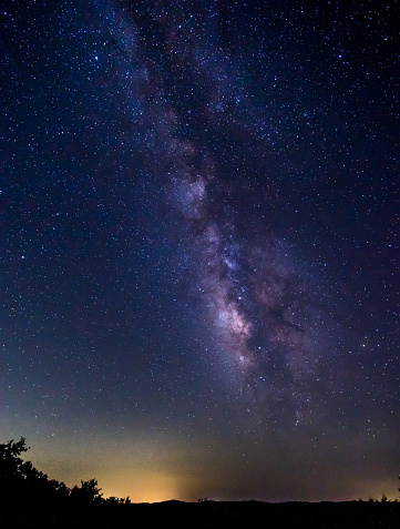 Portrait View of the Milky Way in the Texas Skies with City Light Pollution in the background
