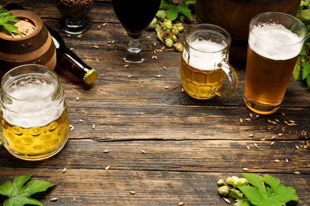 istock Cold beer with foam on a wooden table 1338950722