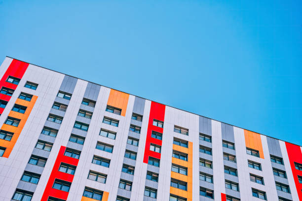 istock Colorful apartment block against a blue sky 1338956592
