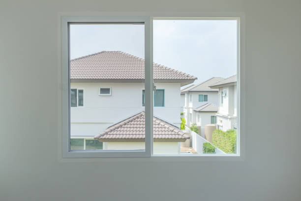 istock Glass window frame house interior on white wall 1338957293