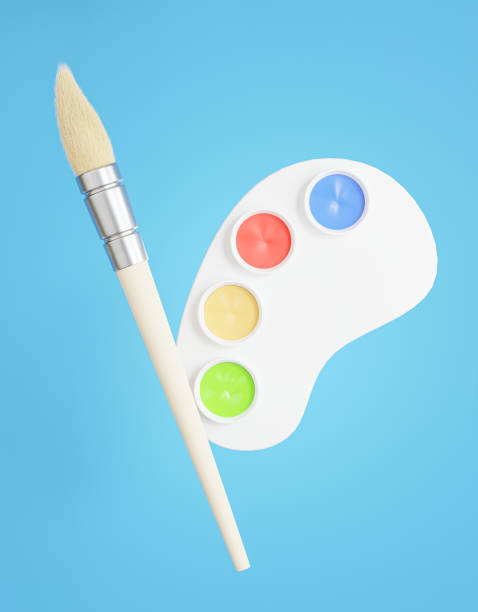 istock palette,paint brush on blue background. 1338957862