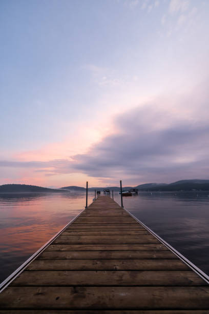 istock Watching Summer Sunset on the Pier by the Lake 1338958839