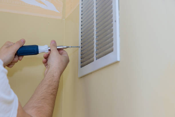 istock Removing air vent cover on wall with square but screw driver 1338961638