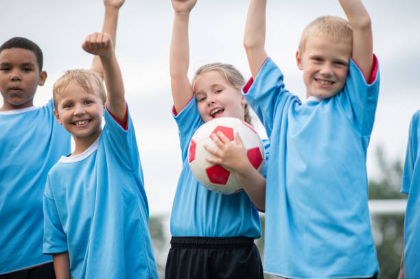 istock Happy children soccer team 1338966087