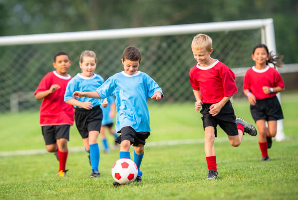 istock Active children playing soccer in the summer 1338966097