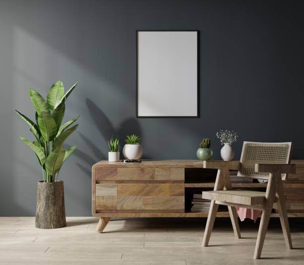 istock Mockup poster frame in modern living room interior design with dark empty wall. 1338968549
