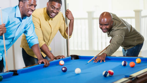 istock Three African-American men shooting pool 1338970301