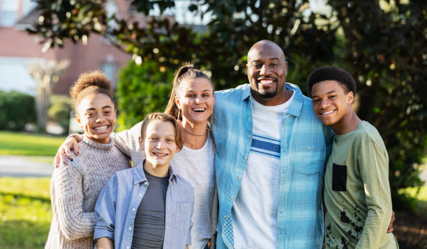 portrait of blended multi-ethnic family, three children - multi ethnic group family child standing imagens e fotografias de stock