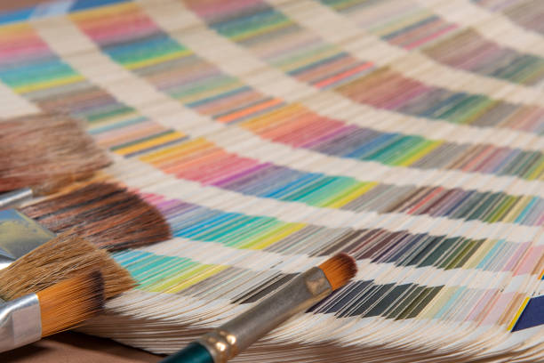 istock Close-up on color palette guide for printing and paintbrush 1338970486