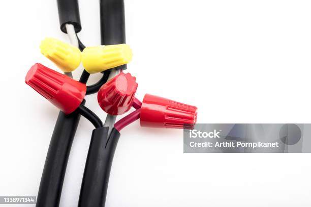 Electric Wiring Connected By A Wire Nut Connectors On White Background Stock Photo - Download Image Now