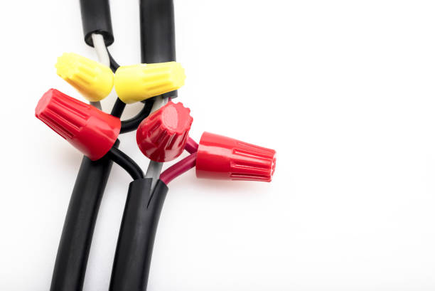 electric wiring connected by a wire nut connectors on white background - splice imagens e fotografias de stock