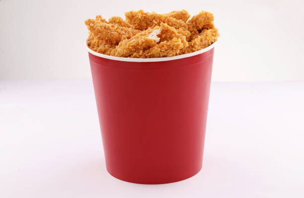 istock breaded fried chicken tenders bucket isolated on white background 1338972297