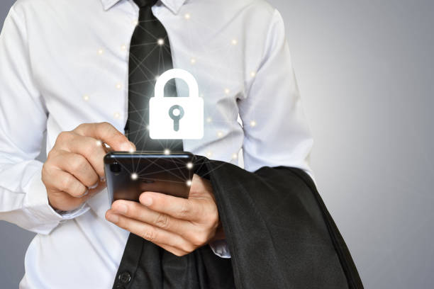 istock Businessman holding mobile phone with shield lock. Cyber security data protection and information technology network concept. 1338978946