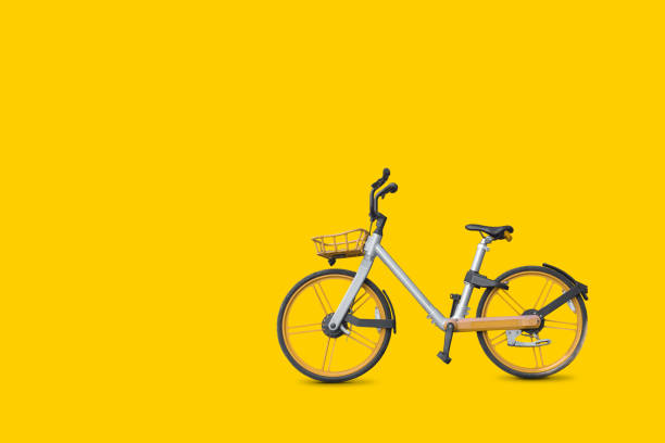 istock Bicycle on vivid yellow color background 1338978962