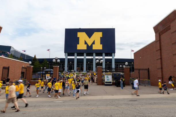 Unidentified Fans exit Michigan Stadium after a University of Michigan football game Ann Arbor, MI - September 4, 2021: Unidentified Fans exit Michigan Stadium after a University of Michigan football game michigan football stock pictures, royalty-free photos & images