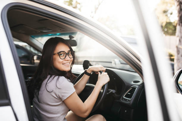 istock asian woman driving car 1338982367