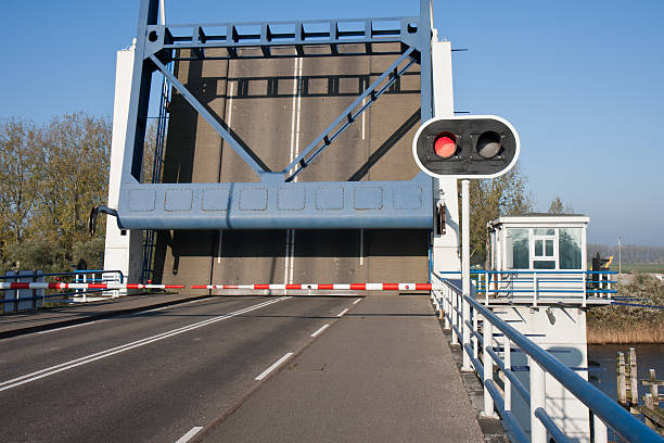 istock Opened bascule bridge in the Netherlands with red stop sign 133898438