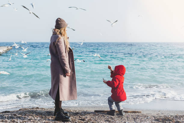 istock Mother and son walk to the seaside 1338988079