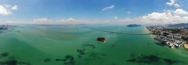 istock Panoramic View Of Penang Bridge Over Sea Against Sky 1338988964