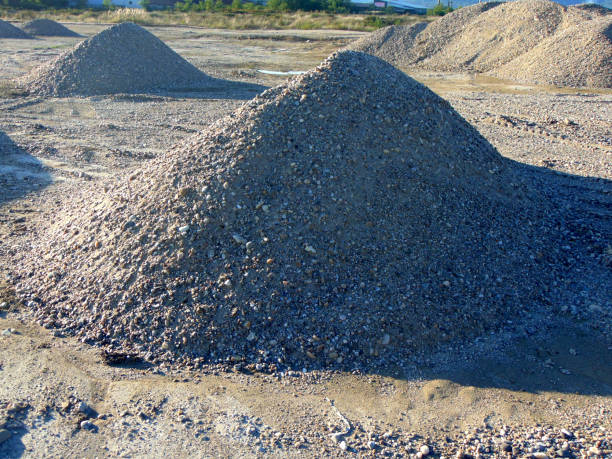 istock several piles of gravel for construction work 1338990021