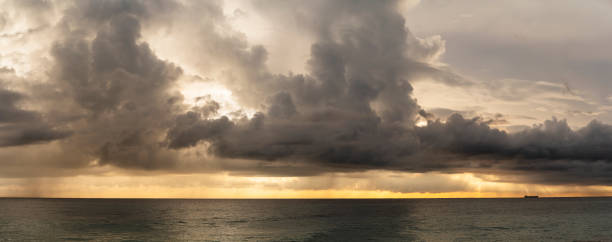 Dramatic sky with massive rain clouds on the scenic sunset in Hikkaduwa, Sri Lanka, in the winter season.