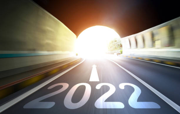 istock Empty traffic tunnel with number 2022 and arrow sign, blurred motion 1338993456